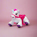 Unicorn ride-on toy walker for toddlers shown on a pink background.