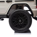 Kids ride-on Mercedes G-Wagon rear wheel and fender in close-up studio view.