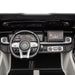 Mercedes kids ride-on car dashboard featuring steering wheel, digital displays, and detailed controls.
