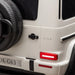 G63 white toy car rear view showing spare tire, door handle, and taillight detail.