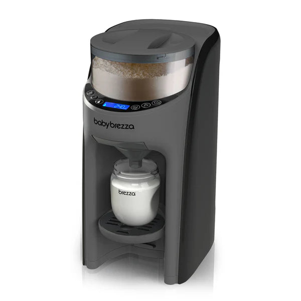 Baby Brezza formula maker dispensing milk powder into a bottle on a white background.