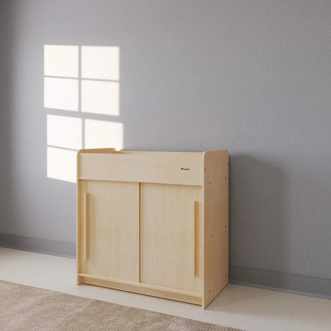 Table à langer Foundations® SafeGlide™ avec portes coulissantes et étagères de rangement