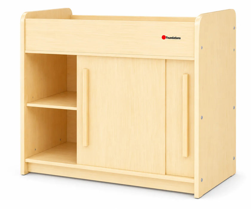 Table à langer Foundations® SafeGlide™ avec portes coulissantes et étagères de rangement