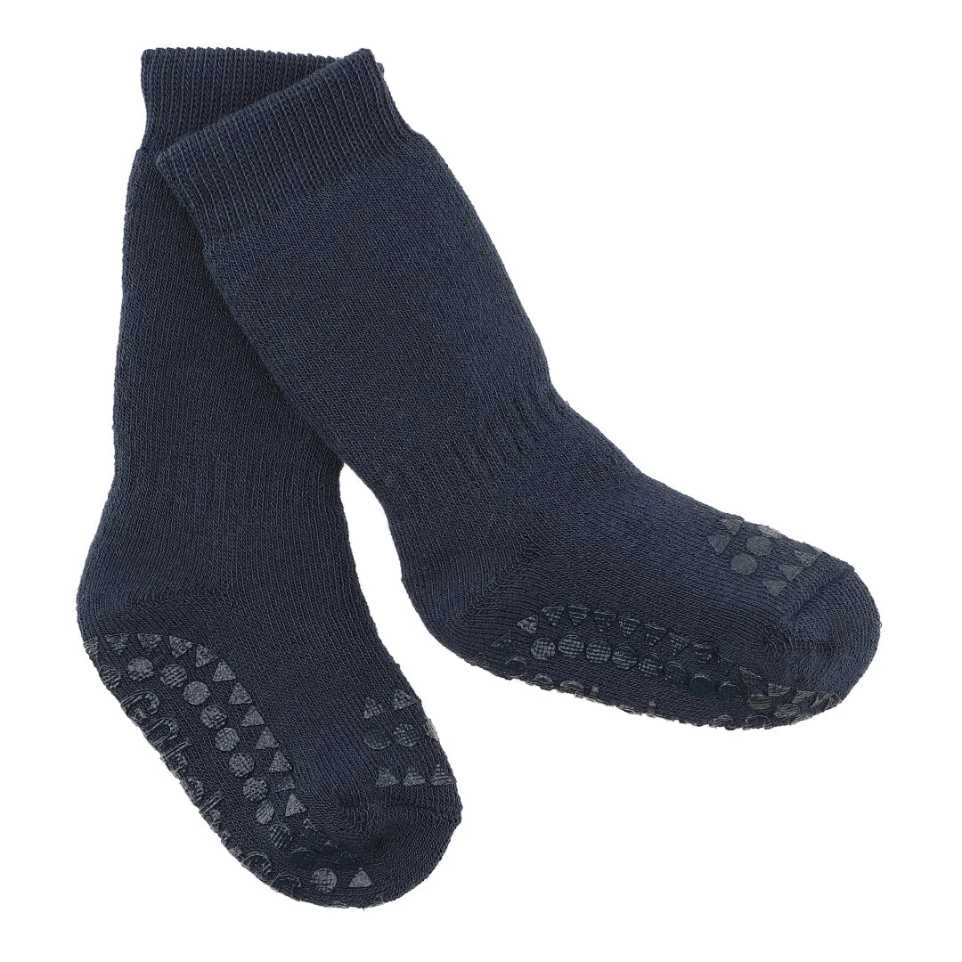 Navy blue non-slip baby socks with rubber grips on white background