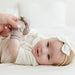 Cute baby girl smiling with mommy holding baby's hands wearing Goumi anti-scratch mitts Pewter - Goldtex