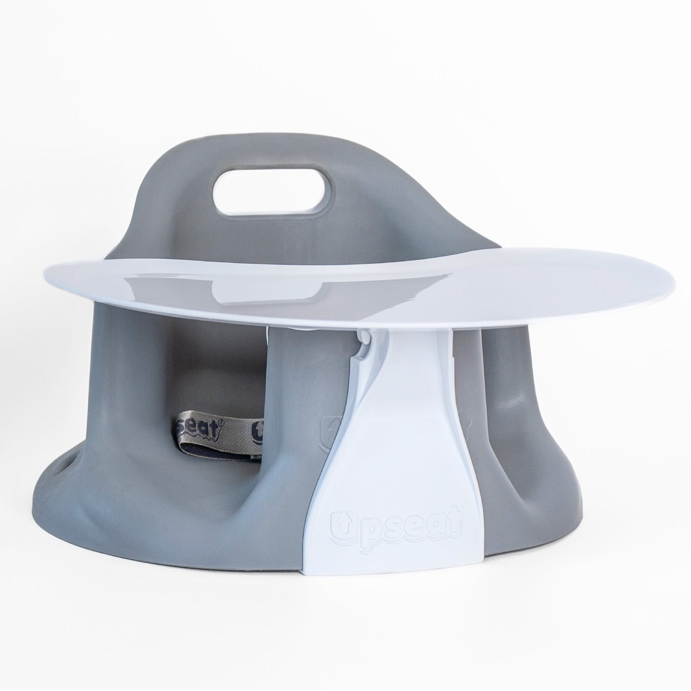 Gray baby floor seat with attached white tray and safety harness against white background