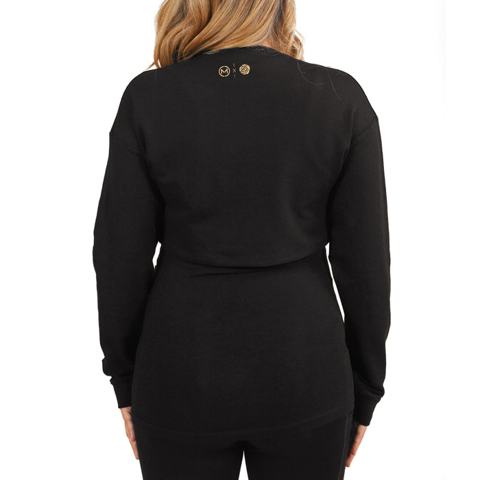 HERA BLK long sleeve black maternity top shown from the back on a woman with blonde hair.