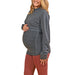 HERA grey maternity top shown on a pregnant woman standing against a white background.