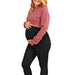 HERA maternity belly band worn by a pregnant woman smiling in casual clothes on a white background.