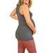 HESTIA GREY sleeveless maternity top shown on a pregnant woman in side view against white background.