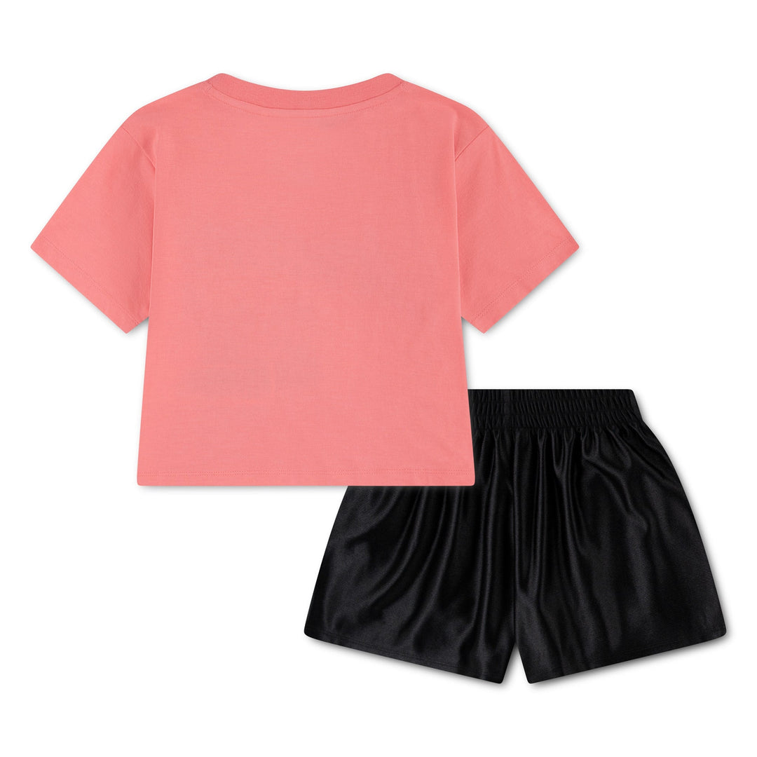 Pink short sleeve kids t-shirt and black shorts set displayed flat on white background.