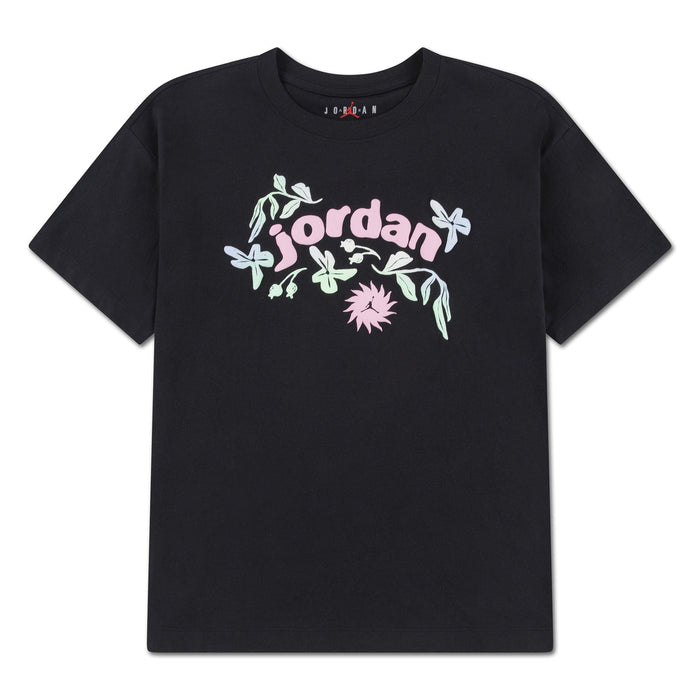 Jordan kids black t-shirt with pastel graphic logo and floral design, displayed flat on white background.