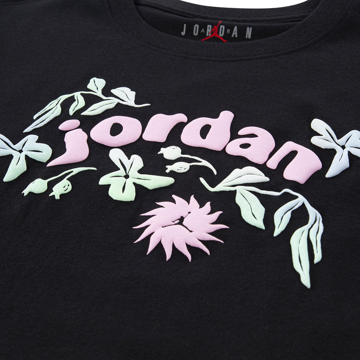 Jordan youth black t-shirt with pastel floral design and raised logo lettering on the chest.
