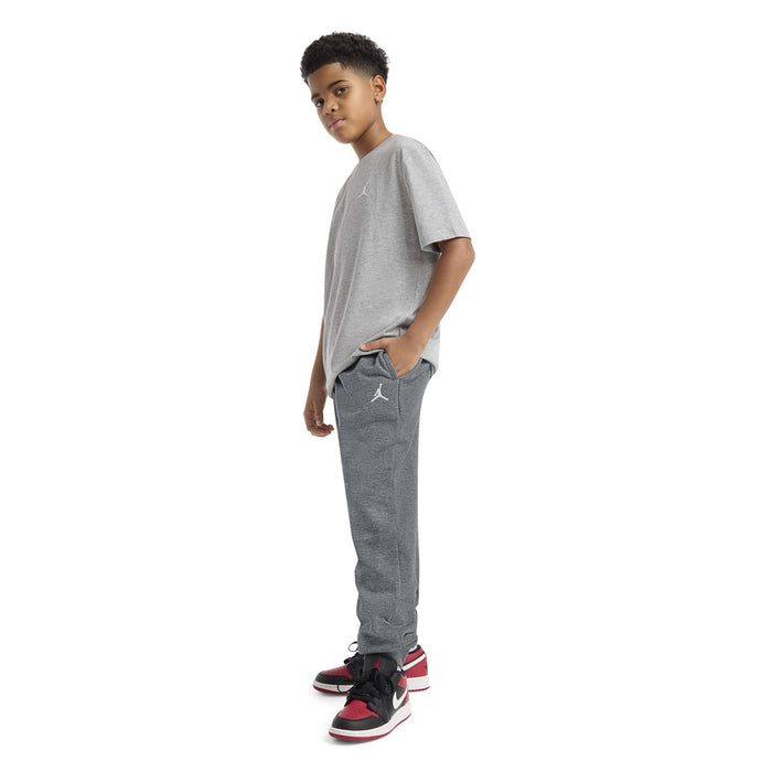 Jordan boys' grey t-shirt and jogger set modeled by a child standing against a white background.