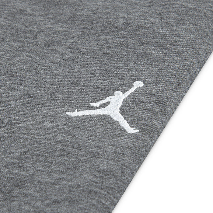 Jordan grey fabric featuring white Jumpman basketball logo embroidered on the surface.