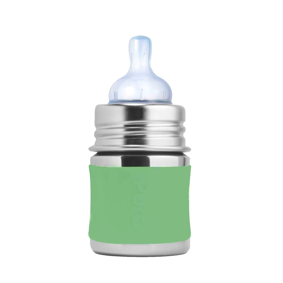Stainless steel baby bottle with green silicone sleeve and clear nipple on white background