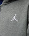 Jordan grey fleece zip hoodie close-up showing embroidered logo on chest.