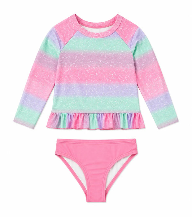 Girls' pink and pastel long sleeve swim set with ruffled hem and matching bottoms on white background.