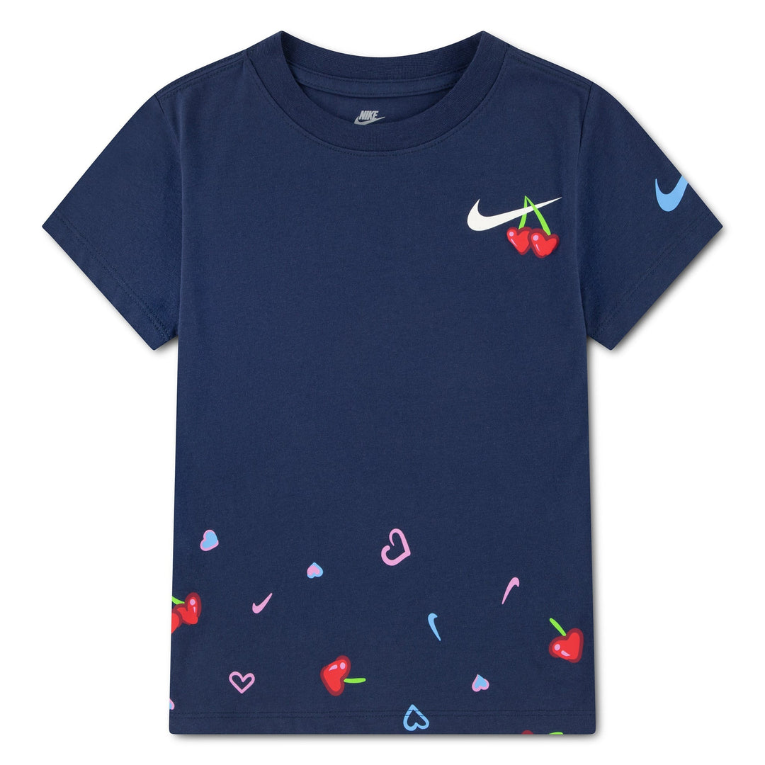 Nike kids' navy blue t-shirt with cherry and heart prints, shown flat on a white background.
