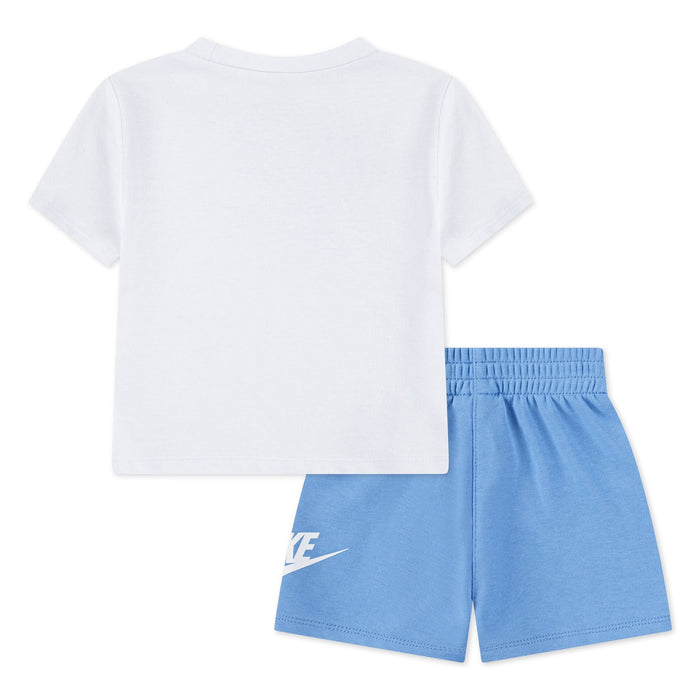 Nike kids’ white t-shirt and blue shorts set shown flat on a white background, back view.
