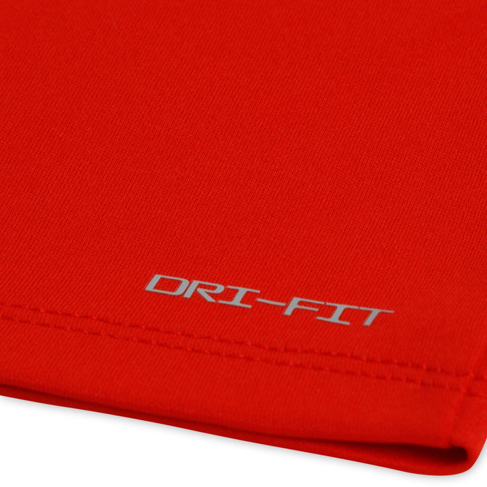 DRI-FIT red athletic fabric close-up showing stitching and logo detail.