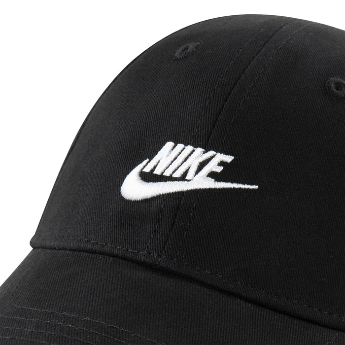 Nike black baseball cap with white embroidered logo shown in close-up view.