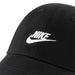 Nike black baseball cap with white embroidered logo shown in close-up view.