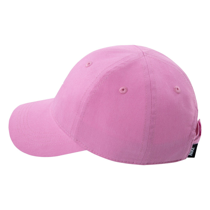 Nike pink cotton baseball cap side view against white background.
