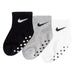 Nike baby grip socks in black, grey, and white colors displayed side by side on a white background.