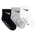 Nike baby grip socks set in black, grey, and white, shown flat with non-slip soles visible.