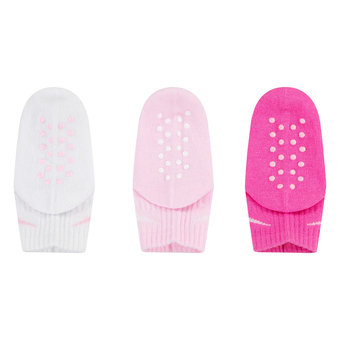 Three pairs of infant non-slip socks in white, light pink, and bright pink displayed on a white background.
