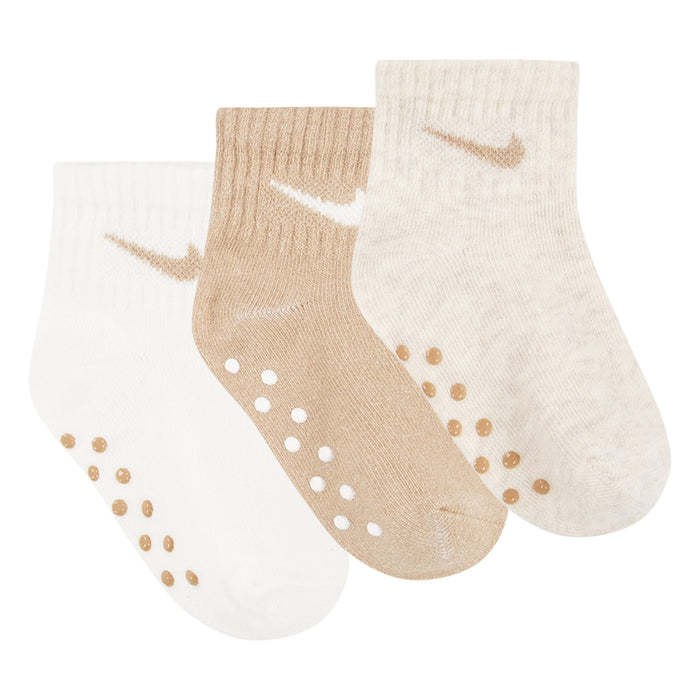 Nike baby non-slip beige and white crew socks set of three shown side by side on a white background.