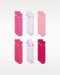Nike kids' crew socks in assorted shades of pink and white, displayed flat in pairs.