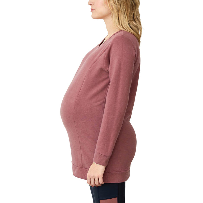 NIXI-S maternity sweater in rose color shown on a pregnant woman in a side profile view.