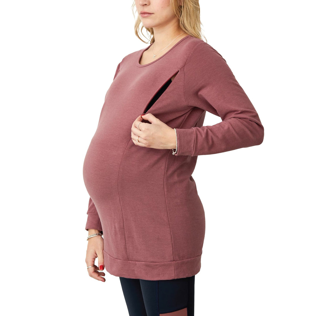 NIXI-ZIP maternity nursing top in mauve, shown on a pregnant woman unzipping the side panel.