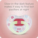 Featuring the Glow-in-the-dark Nuk Orthodontic pacifier on a pink background - Glow-in-te-dark feature makes it easy to find lost pacifiers at night