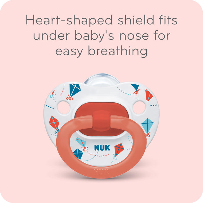 Nuk pacifier with heart-shaped shield on a pink background - Heart-shaped shield fots under baby's nose for easy breathing