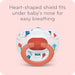 Nuk pacifier with heart-shaped shield on a pink background - Heart-shaped shield fots under baby's nose for easy breathing