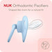 NUK orthodontic pacifier on a pink background - Orthodontic pacifiers - shaped like mom for a natural fit