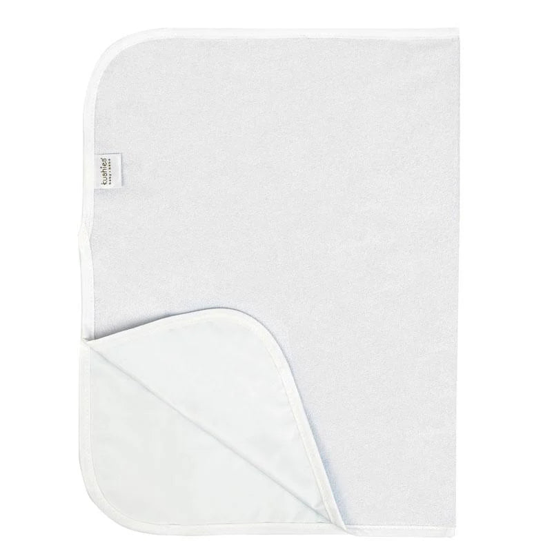 White waterproof baby change pad with soft terry surface and rounded corners