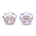 NUK pacifiers with pink and pastel heart and raindrop patterns shown side by side on white background.