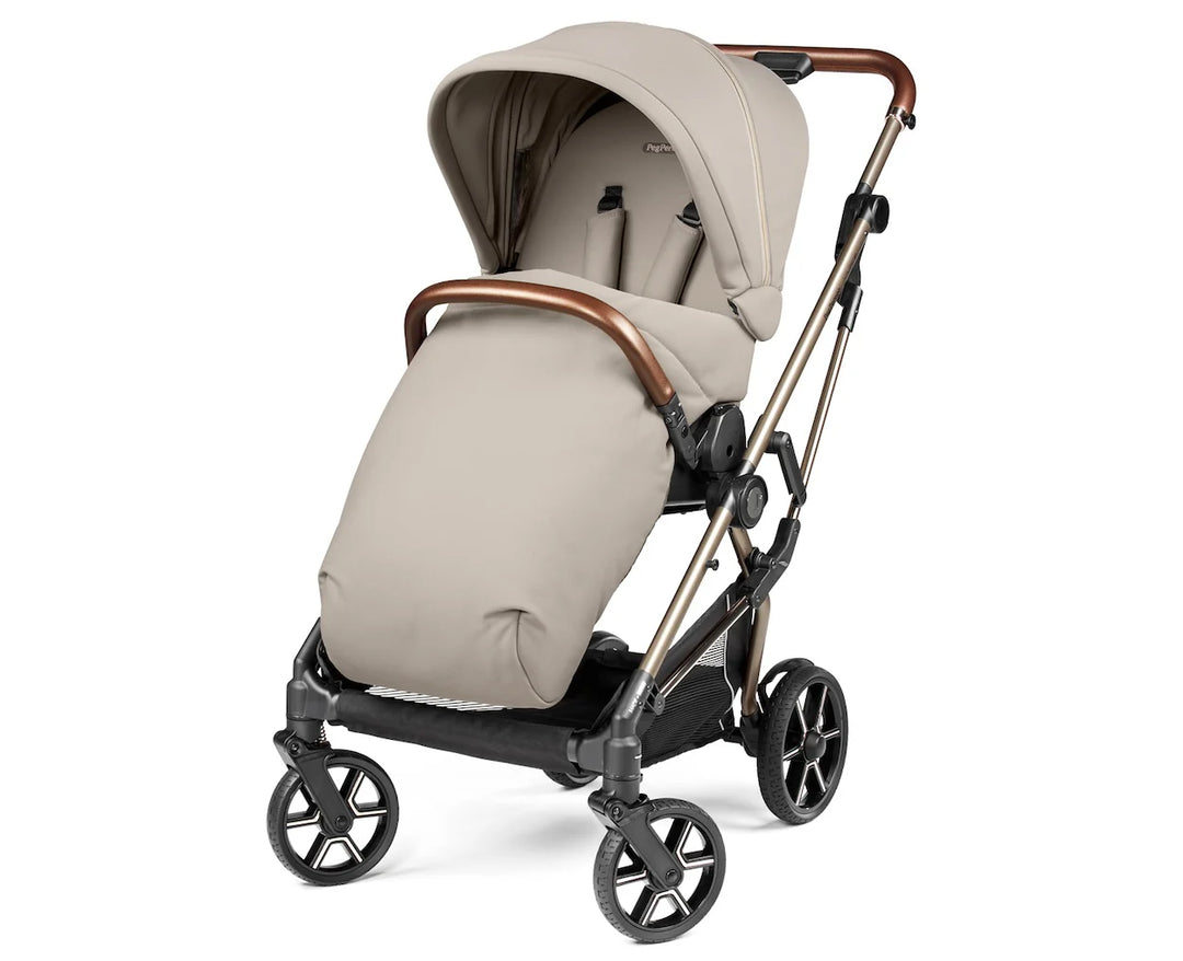 Beige baby stroller with adjustable canopy, padded seat, and four black wheels