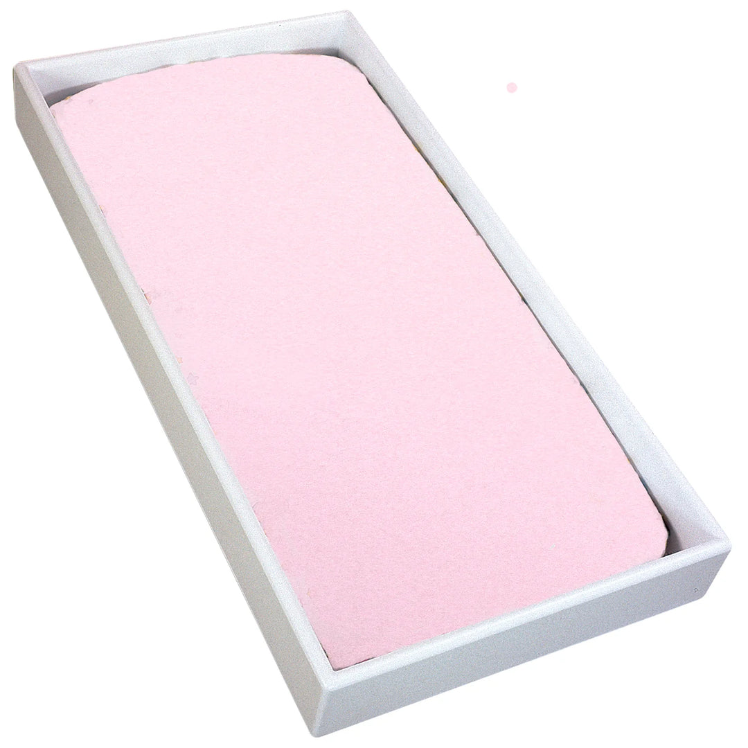 Pink flannel changing pad cover on a white rectangular baby changing pad