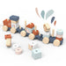 Wooden stacking train toy set displayed on a white surface with colorful blocks and wheels.