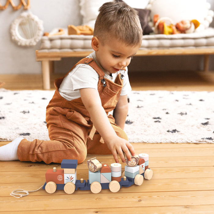 Stacking train toy in use by a young child sitting on a wooden floor in a cozy playroom.
