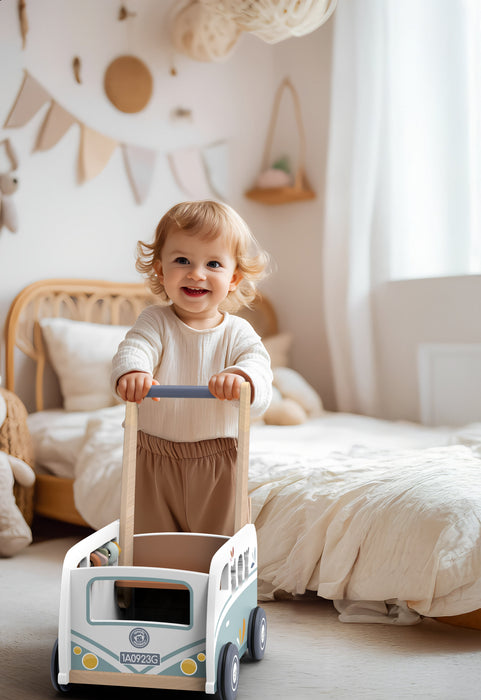 SP1045 Van Multi-Activity Walker with smiling toddler pushing it in a cozy bedroom setting.