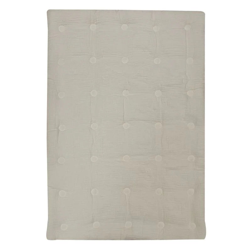 Beige muslin comforter with tufted buttons, soft quilted baby bedding