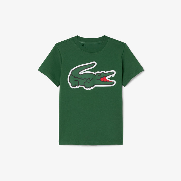 Kids' green t-shirt with a large cartoon crocodile graphic, displayed flat on a white background.