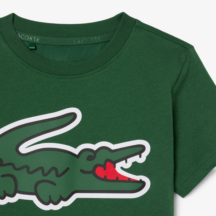Lacoste kids’ green T-shirt with large crocodile graphic on front, shown flat on white background.
