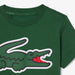 Lacoste kids’ green T-shirt with large crocodile graphic on front, shown flat on white background.